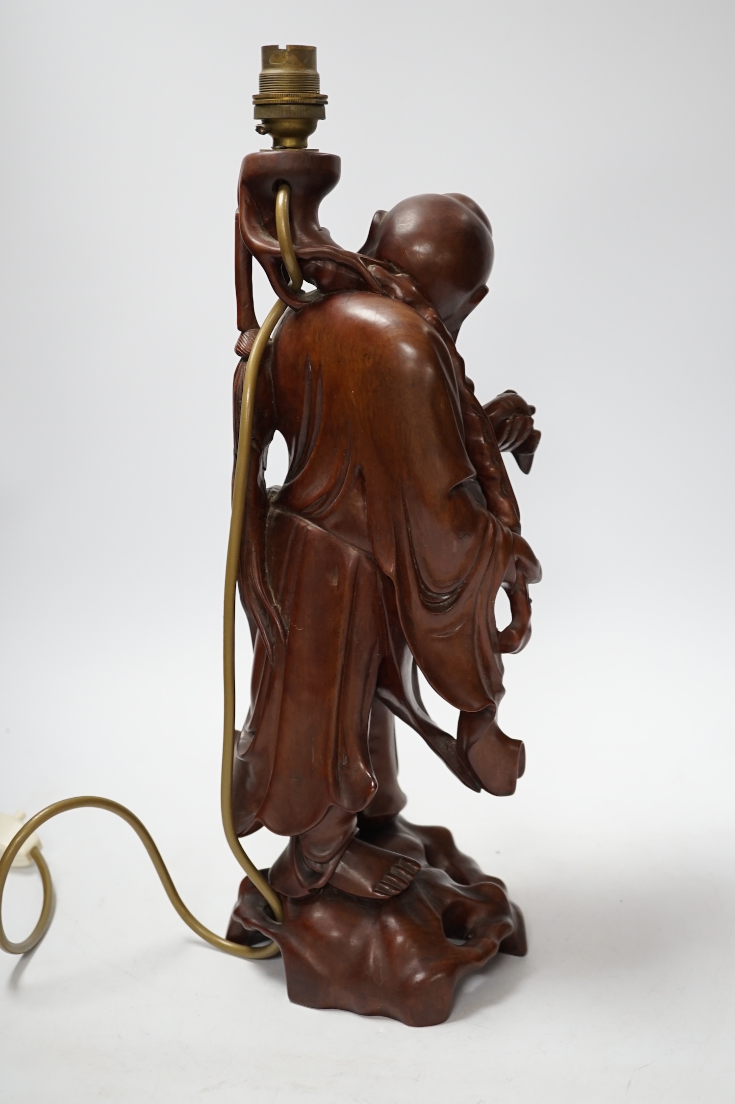 A Chinese carved hardwood figural table lamp base 42cm high